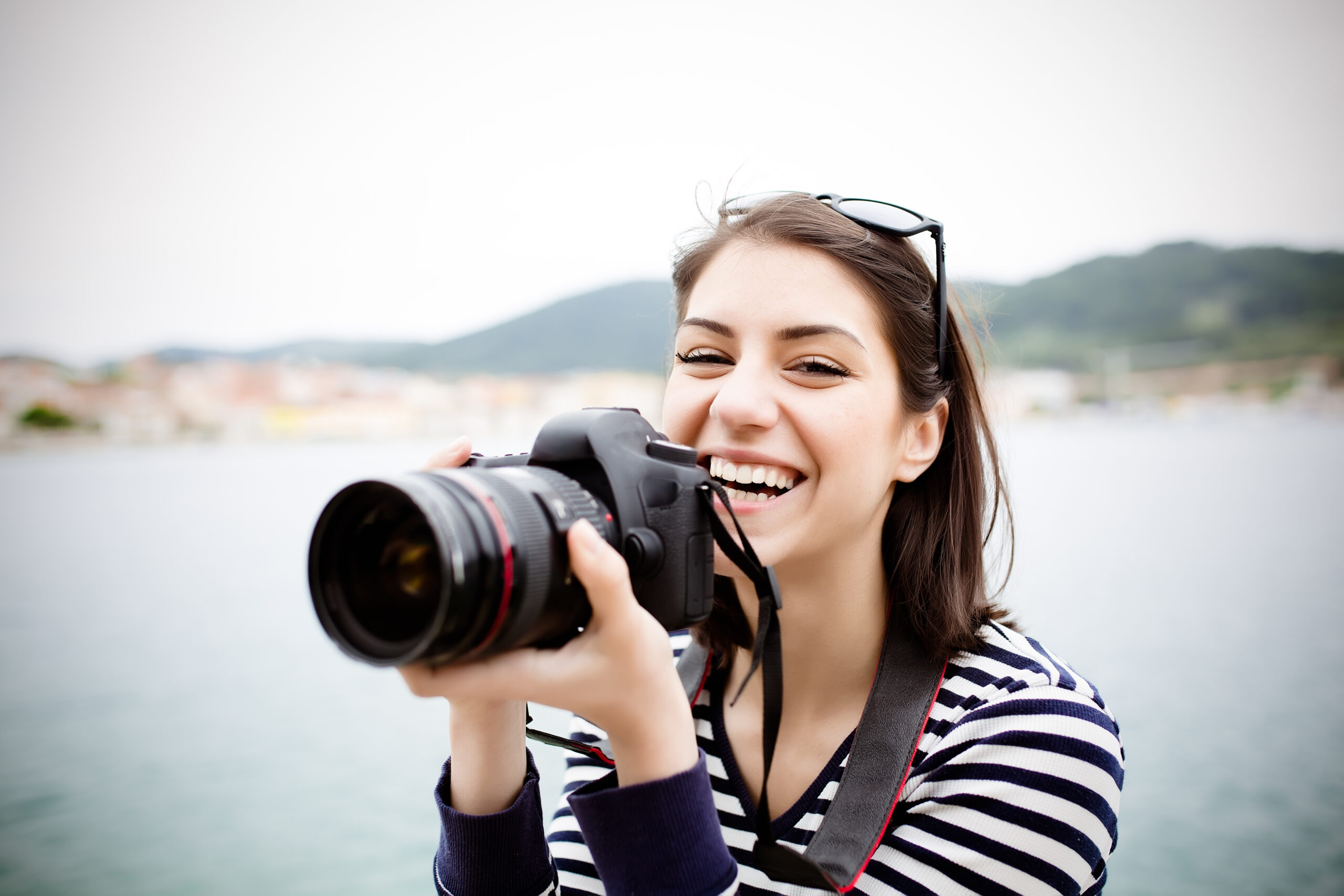 Happy,Woman,On,Vacation,Photographing,With,A,Dslr,Camera,On Happy,Woman,On,Vacation,Photographing,With,A,Dslr,Camera,On